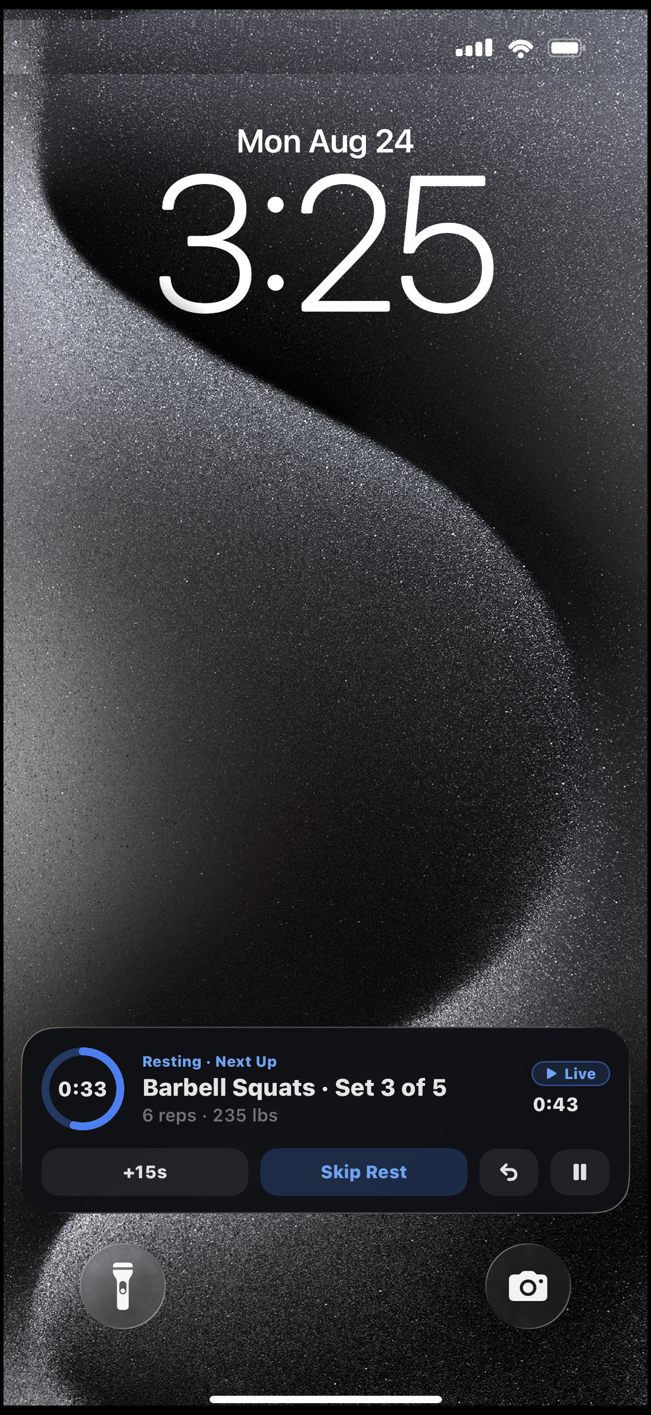 Lock Screen Live Activity showing the next set with a Log Set button